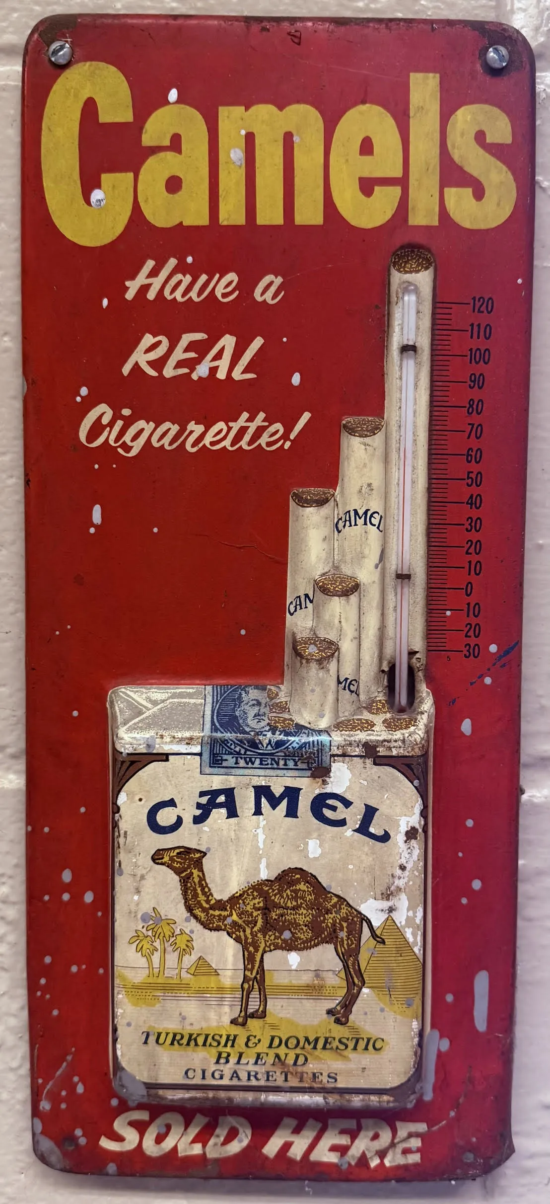 Vintage Camel cigarettes tin advertising thermometer, worn red collectible with visible glass tube